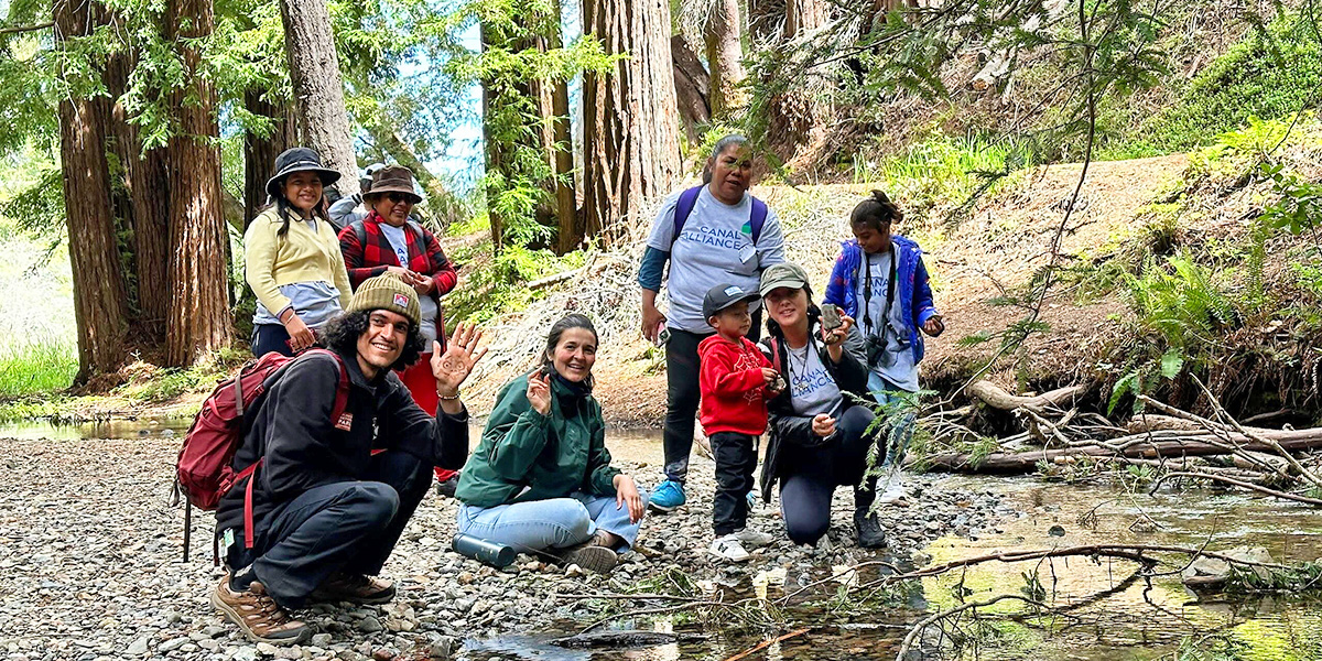A group of people at an event at Lake Lagunitas.